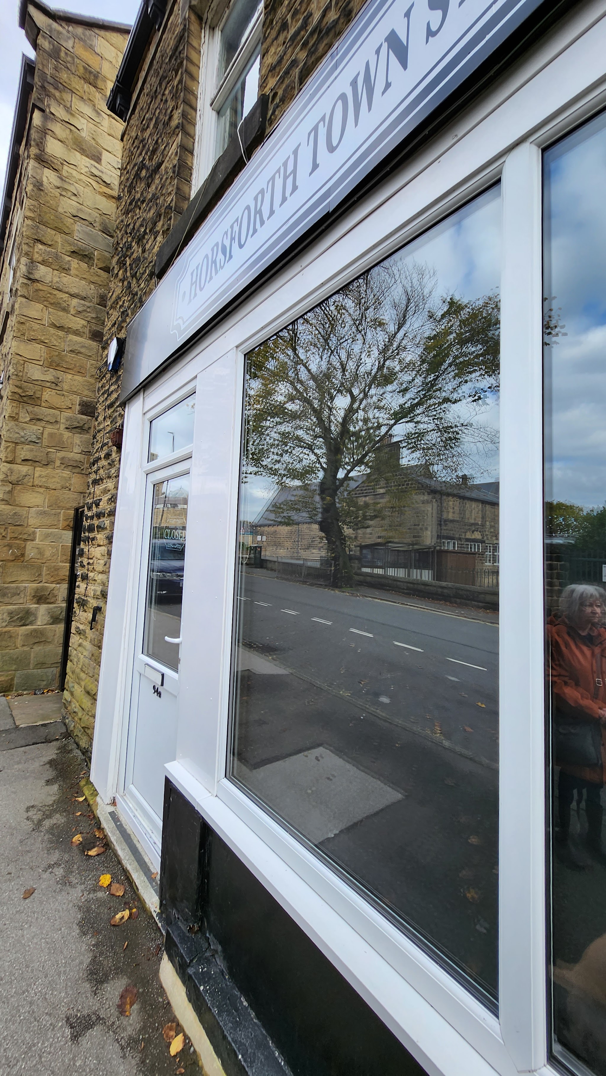 Our white shopfront and door at 94b Town Street, Horsforth